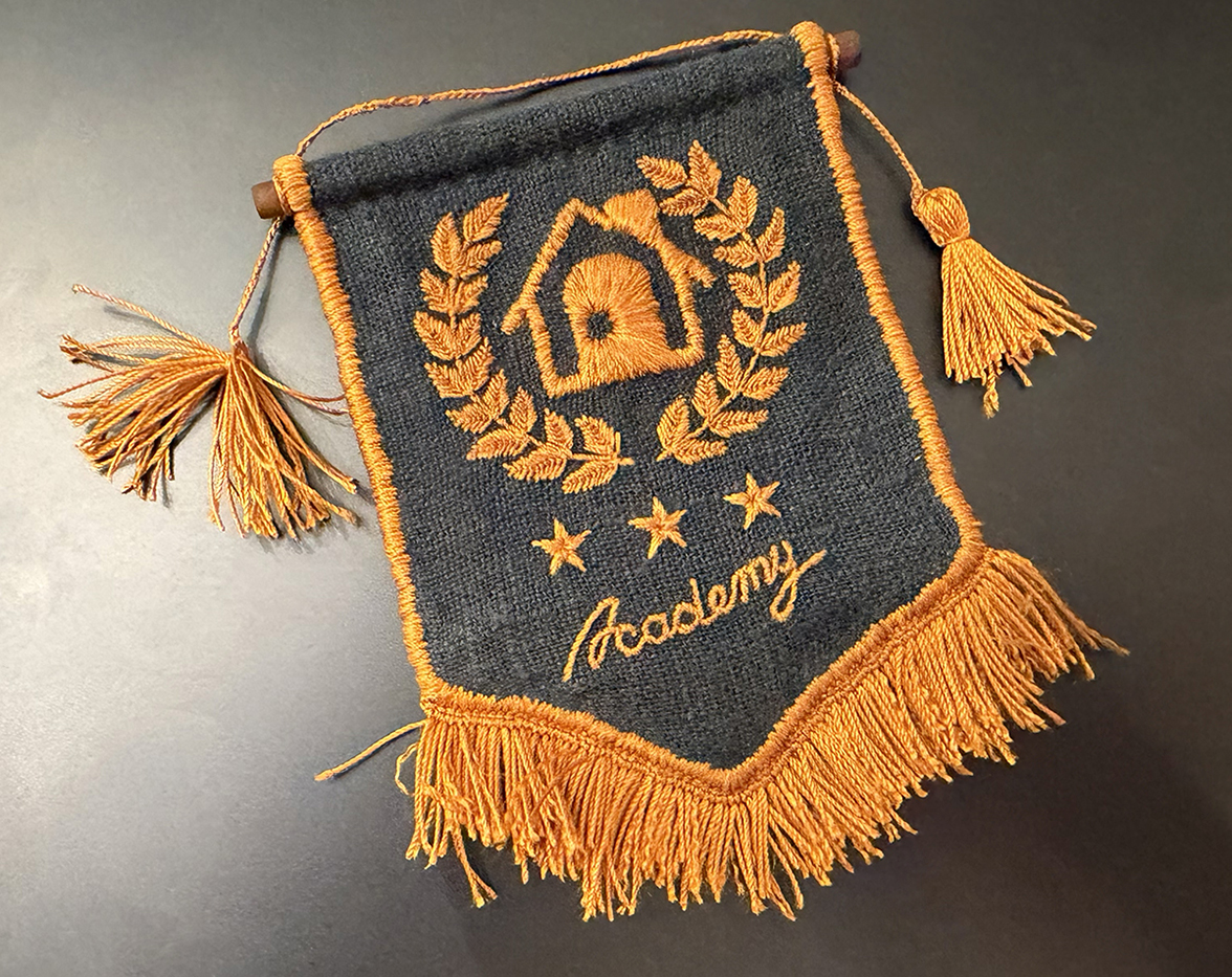I incorporated the hanging cord's ends into the tassels before gathering them together with another piece of thread about a third of the way down from the top of the tassel.