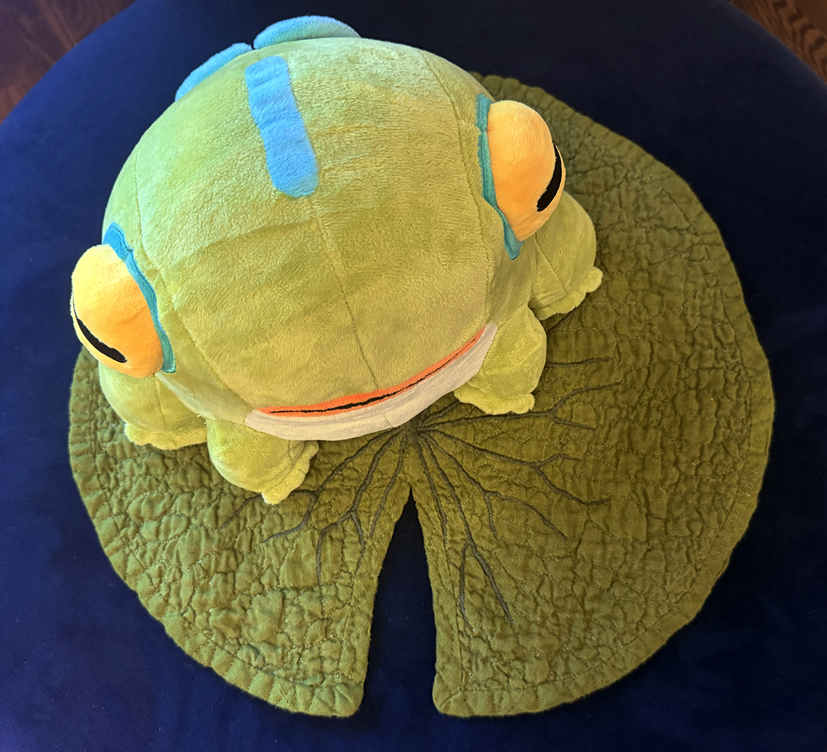 Frinos sits comfortably on the lilypad.