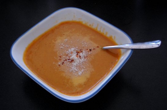 Curried pumpkin soup topped with romano