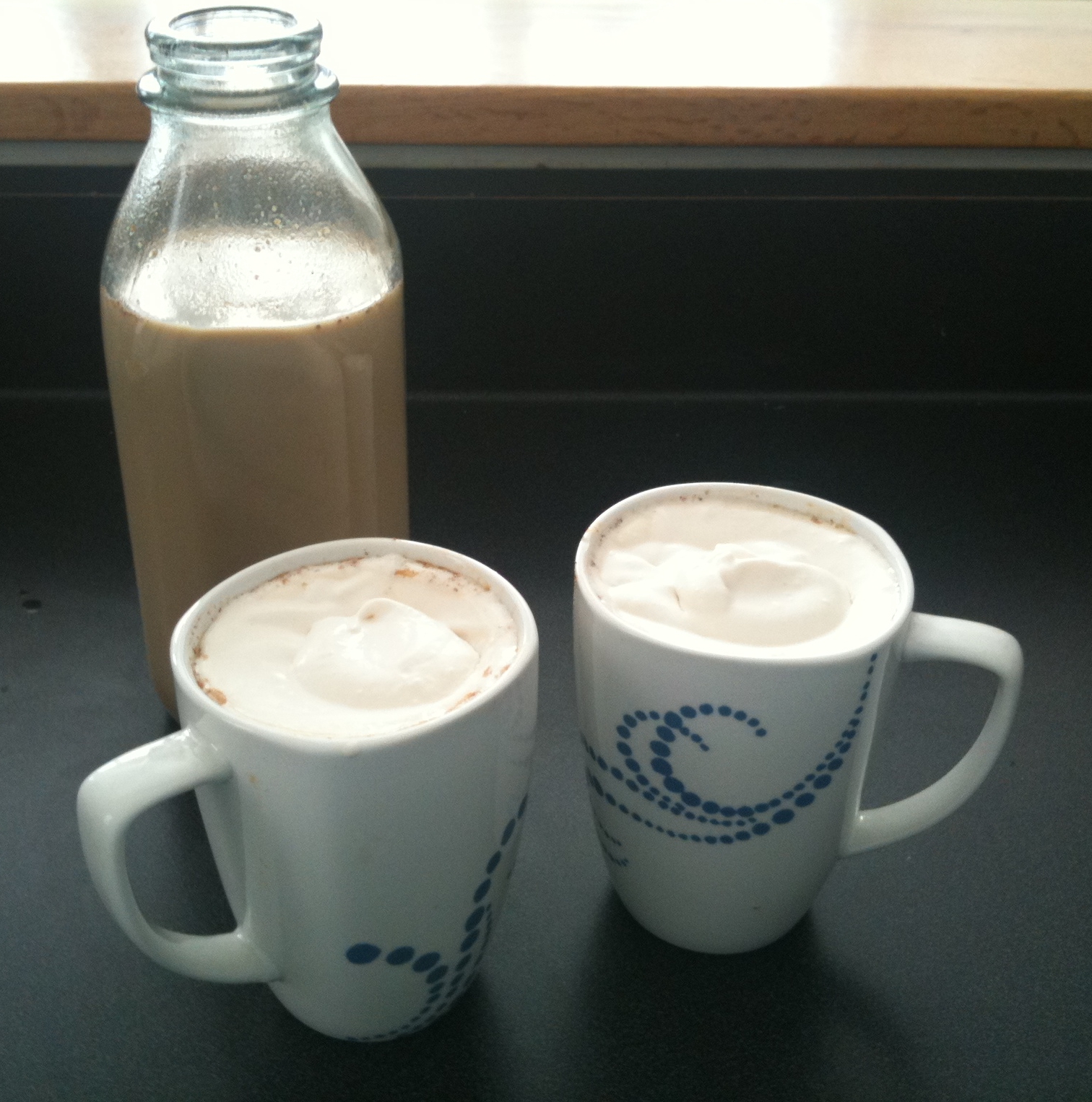 Homemade pumpkin spice lattes with whipped cream