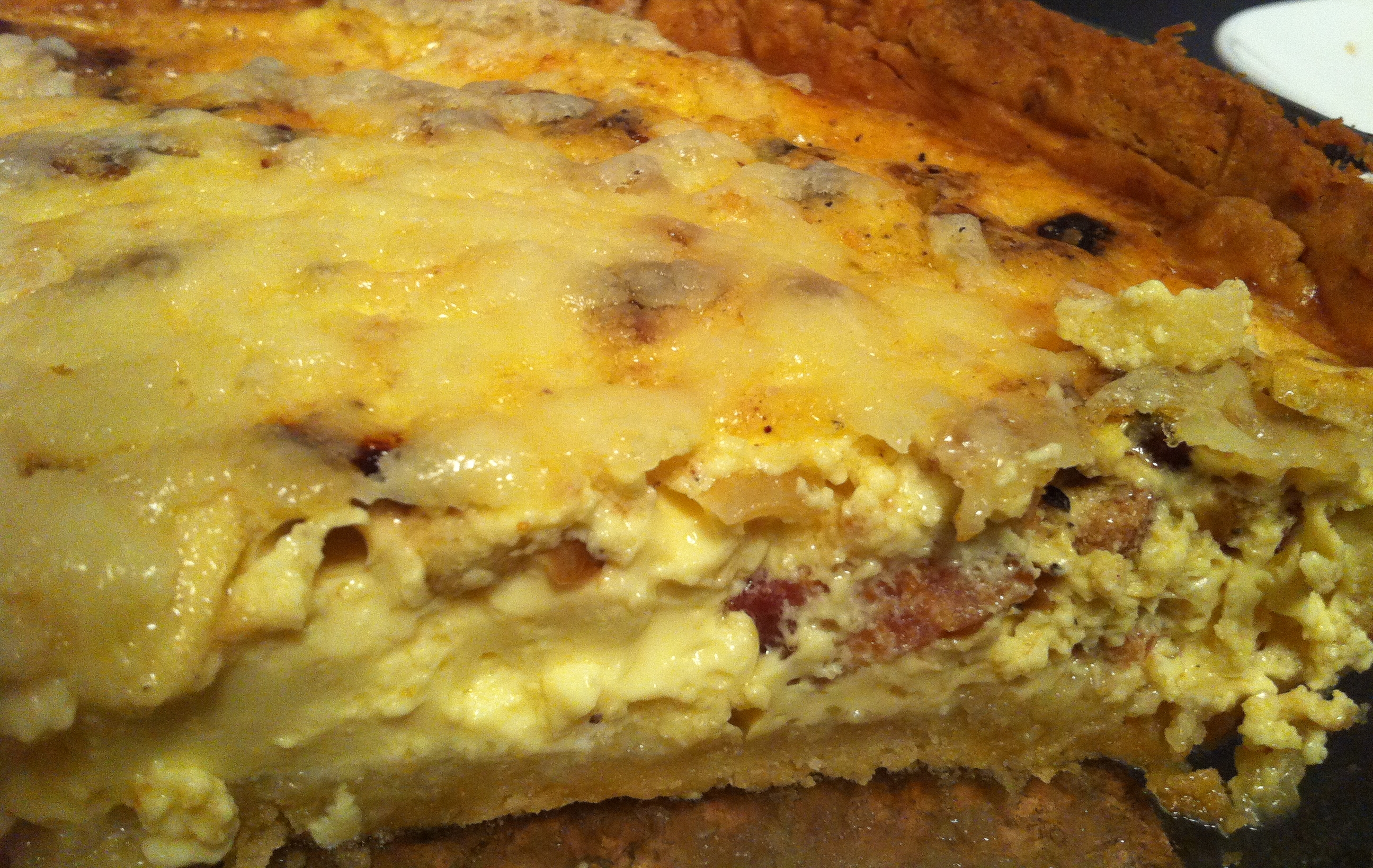 Quiche with crispy bacon, caramelized onions, green apples, and sharp cheddar cheese