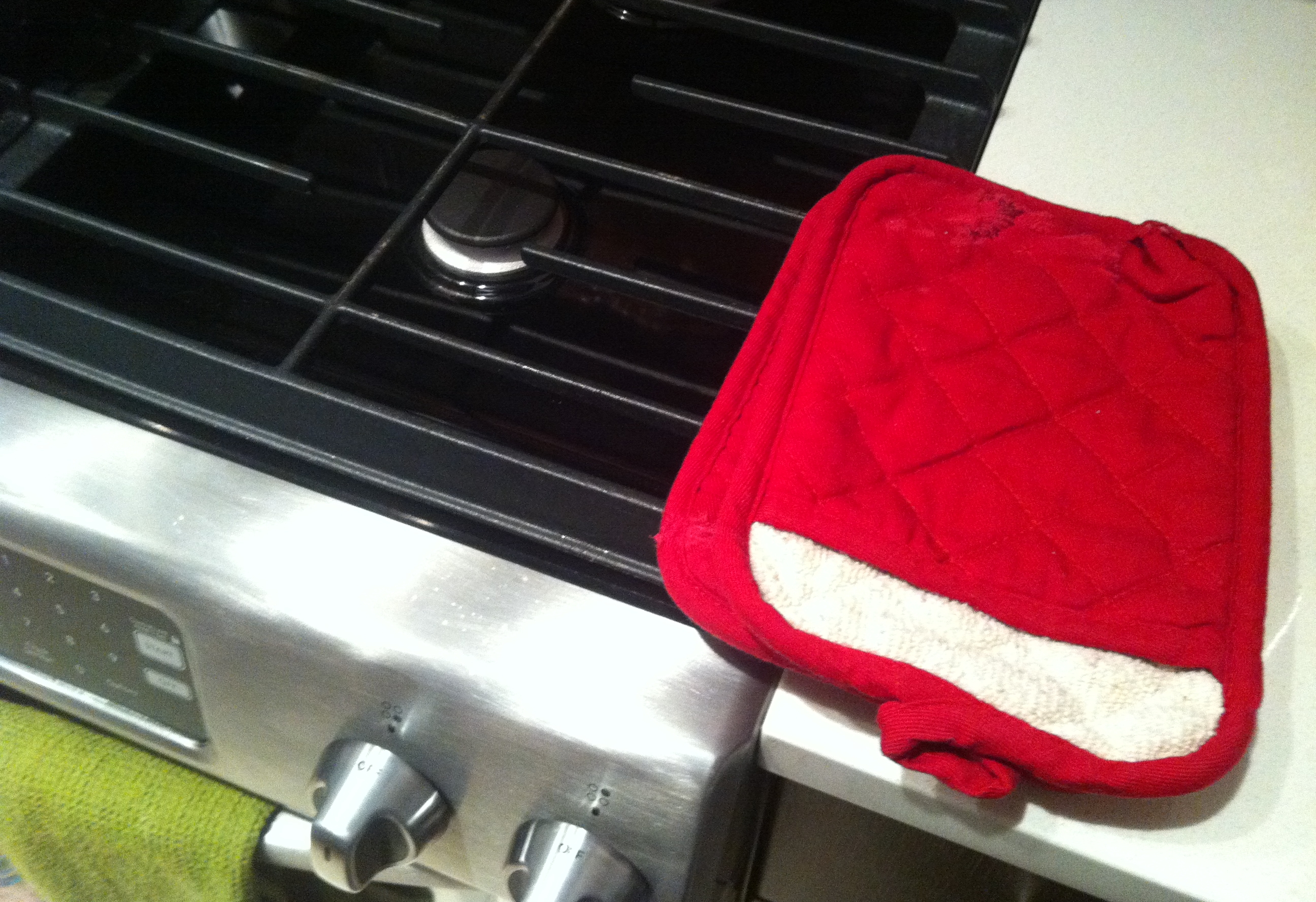 Potholders right next to the stove; okay, they're normally a few inches to the right of where they are here