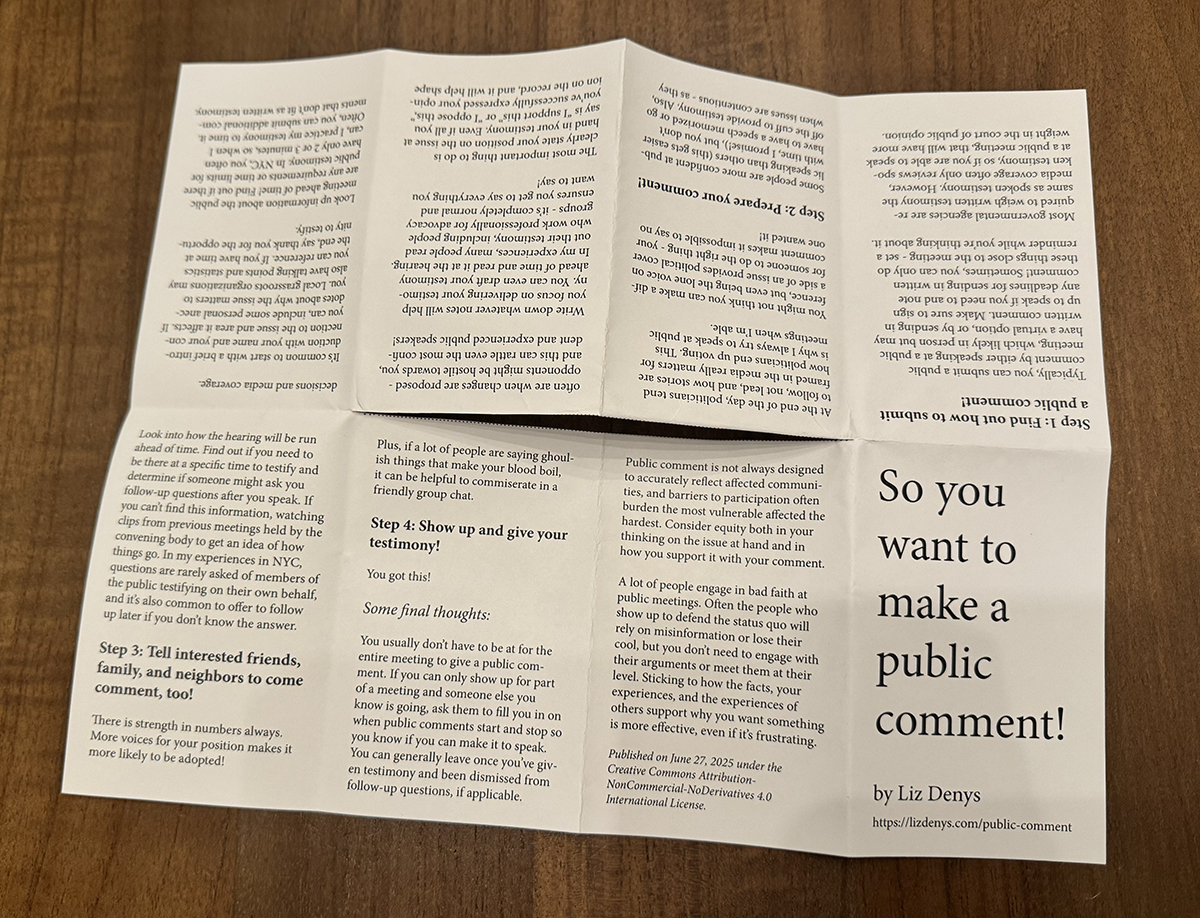 The reopened paper has a slit across the middle of the sheet that spans the width of the two columns of middle pages in the sheet of paper.