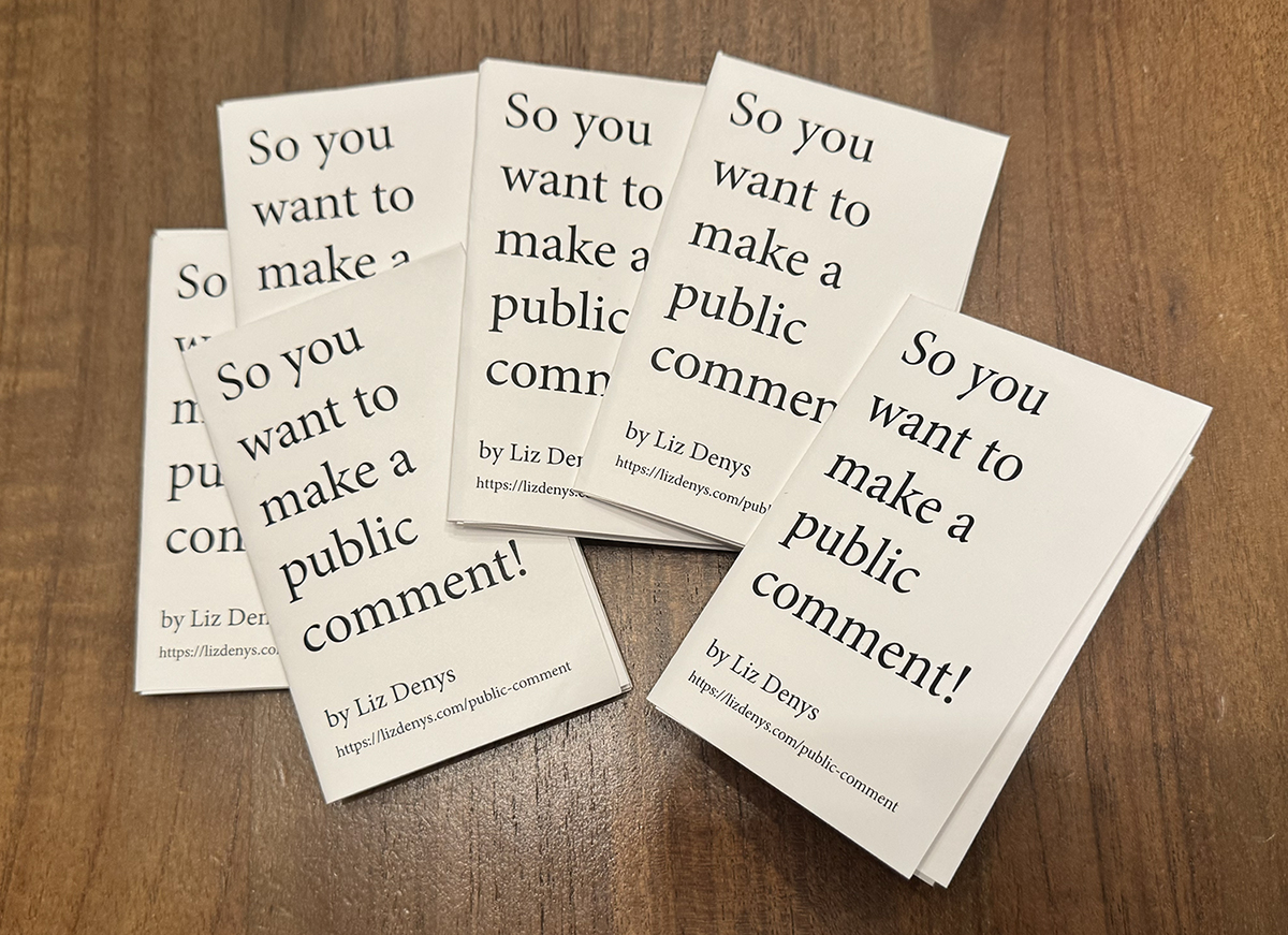 A handful of So you want to make a public comment! zines