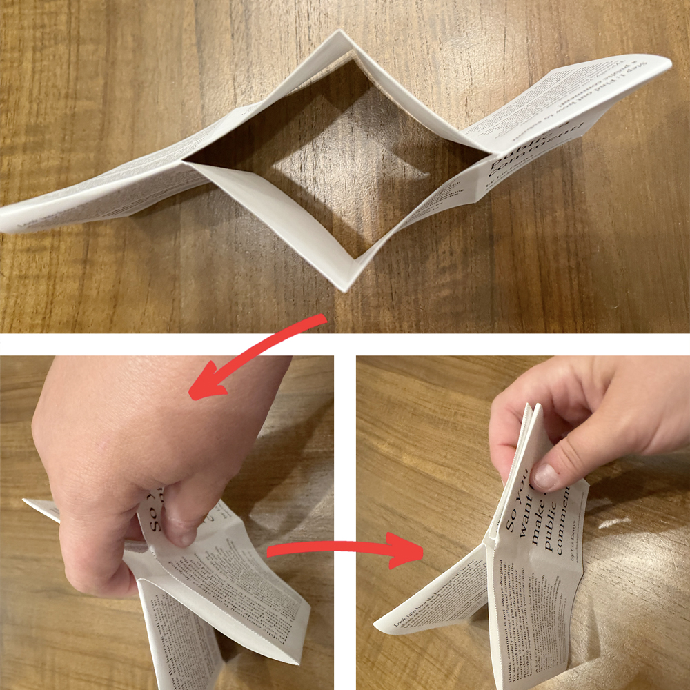 Part of the steps to fold a mini-zine, specifically the ones after the slit has been cut in the middle