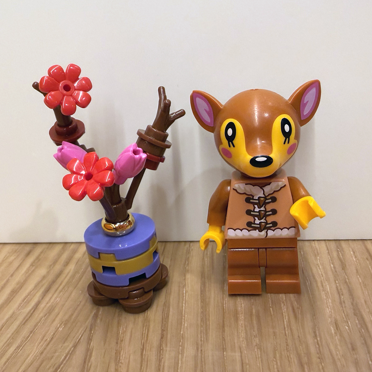 My LEGO mini plum blossom next to the LEGO Fauna minifigure