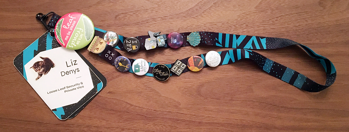 My XOXO 2018 badge (Liz Denys - Loose Leaf Security & Private Vics) and lanyard with the many pins I accumulated over the course of the festival